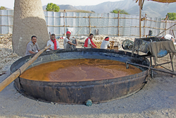 Workers in Pune, India, make jaggery in the traditional open-pan method.